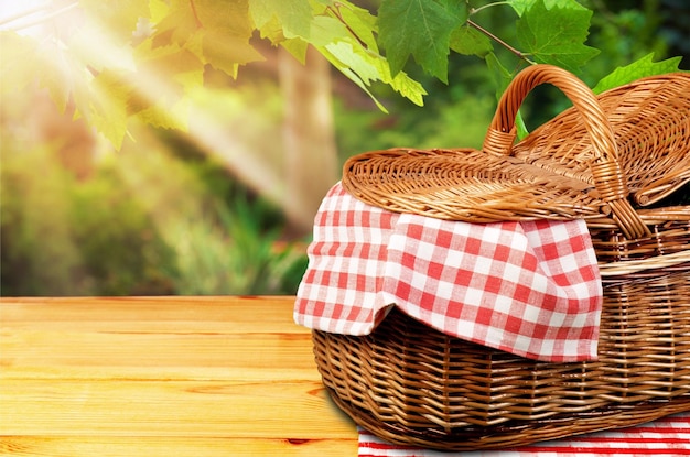 Picnic Basket with napkin on nature background