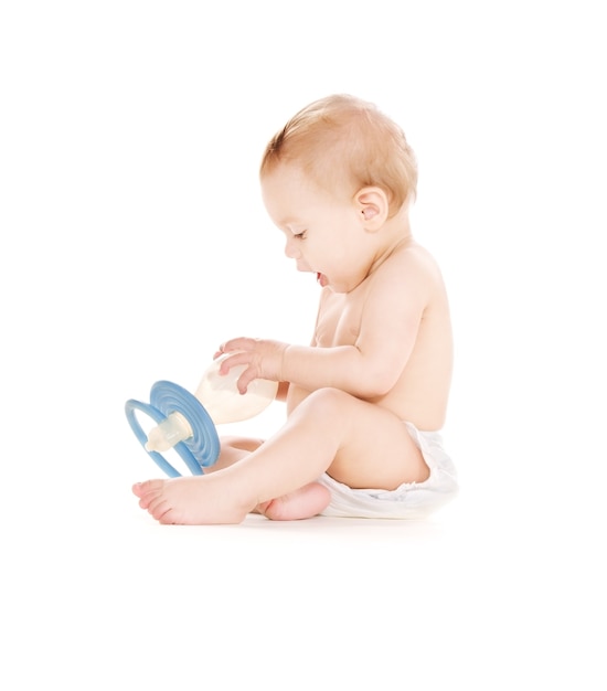 picture of baby boy with big pacifier over white