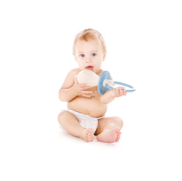 picture of baby boy with big pacifier over white