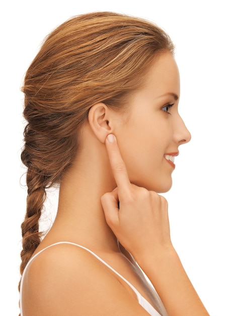 picture of beautiful woman pointing to ear