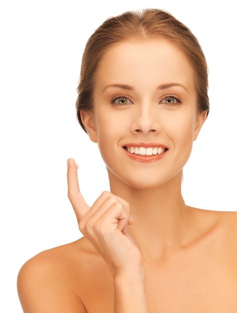 picture of beautiful woman with moisturizing creme drop.