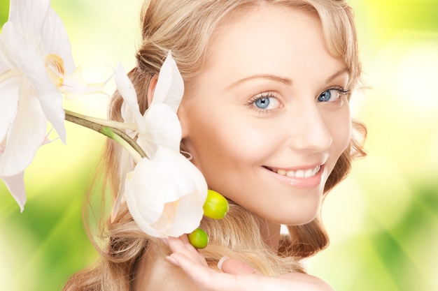 picture of beautiful woman with orchid flower