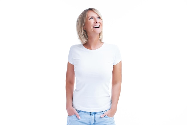 Picture of blonde woman over back isolated background making happy faces