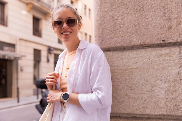 Picture of cute woman staying on the street look at camera