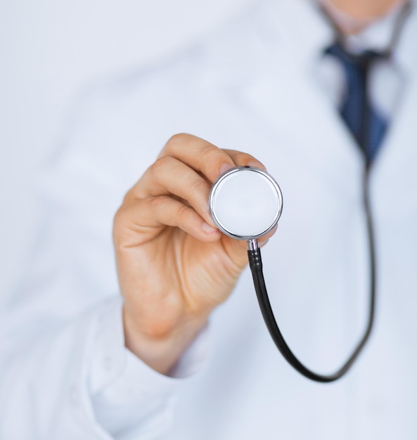 picture of doctor hand with stethoscope listening something