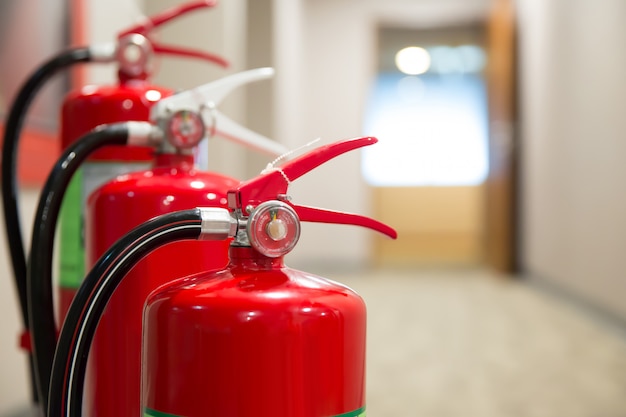 Picture of a fire extinguishers with Fire hose on the right hand side Prepare for fire safety and prevention.