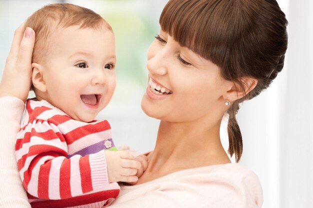 picture of happy mother with adorable baby at home