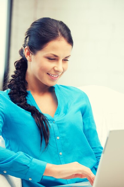 picture of happy woman with laptop computer.