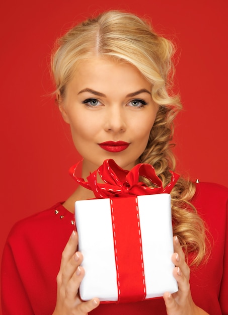 picture of lovely woman in red dress with present