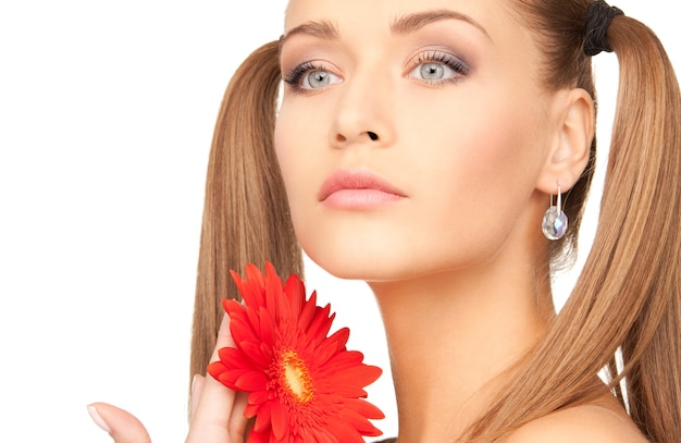 picture of lovely woman in towel with red flower