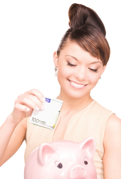 picture of lovely woman with piggy bank and money