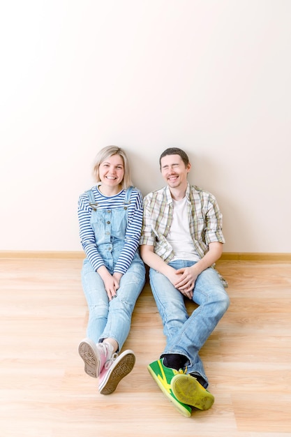 Picture of man and woman sitting on floor