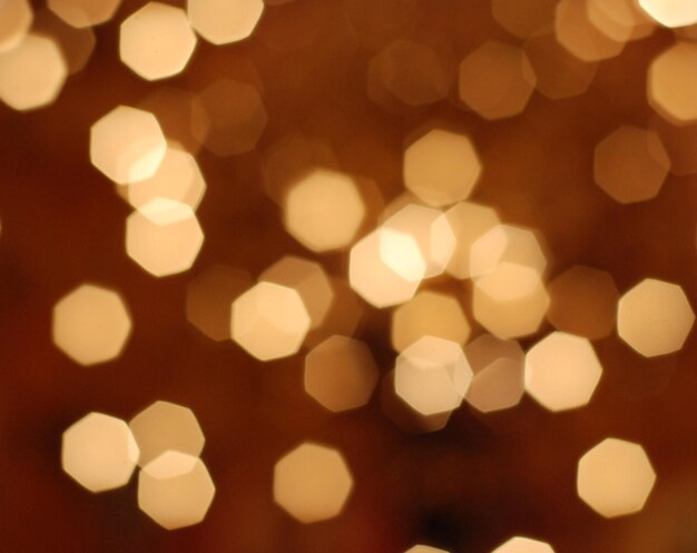 Photo picture of many defocused orange candle ligths