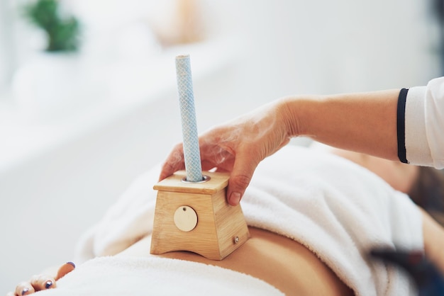 Picture of moxibustion therapy on woman body