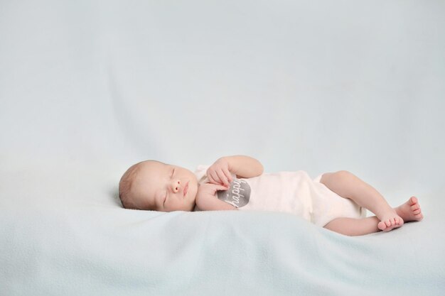 Photo picture of a newborn baby peacefully sleeping