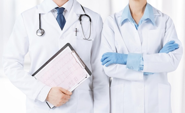 picture of nurse and male doctor holding cardiogram