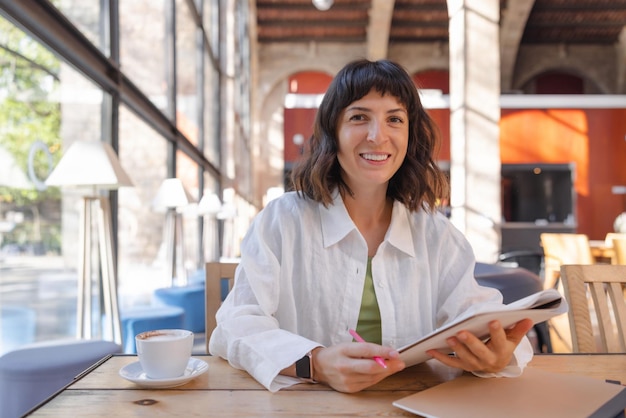 Picture of pretty woman sitting in cafe