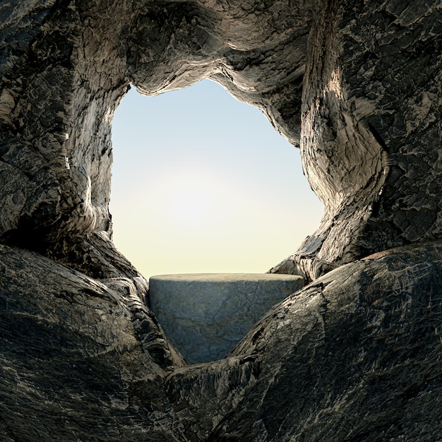 A picture of a rock with a blue sky and the sun behind it