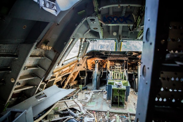 The picture shows an old wrecked airplane cockpit