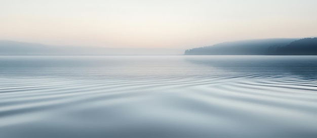 a picture of a water with a blurry background and a blurry image of a boat in the background