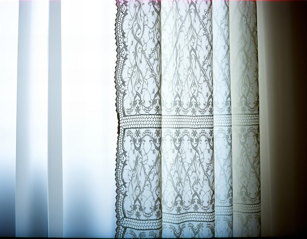 a picture of a window with a white background and a black and white photo of a lace curtain