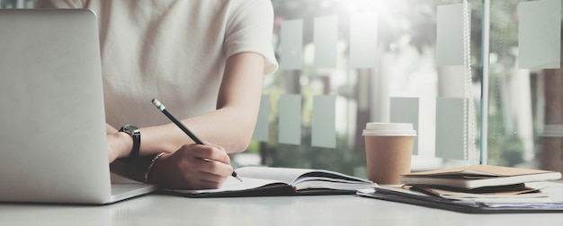 Picture of woman hand filling in invoice paperOnline Taxes And Invoice Billing Electronic Management