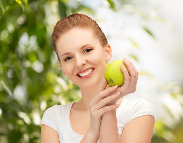 picture of young beautiful woman with green apple