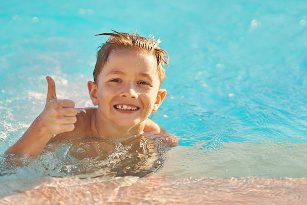 Picture of young boy playing in outdoor aqua park