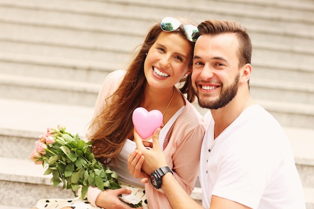 A picture of a young romantic couple on a date in the city