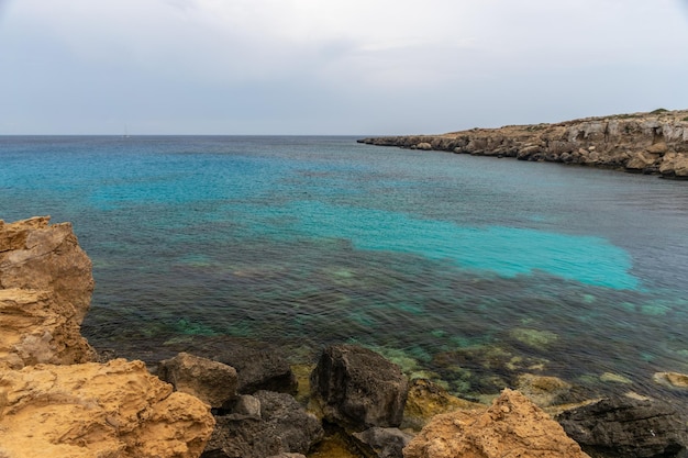 The picturesque blue lagoon on the coast of the calm sea