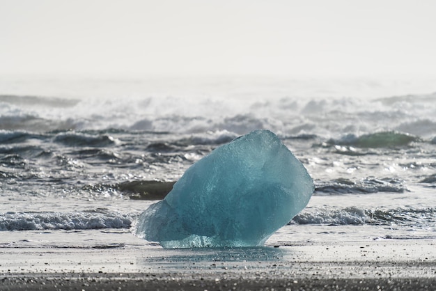 Picturesque iceberg piece on diamond beach near jokulsarlon lagoon