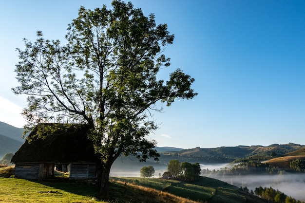 Picturesque landscape with old traditional house on hill nature quiet place