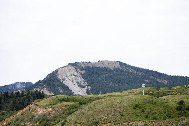 Picturesque Mountain Range In A Rural Area With A Tower On The Top