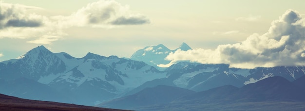 Picturesque Mountains of Alaska in summer. Snow covered massifs, glaciers and rocky peaks.