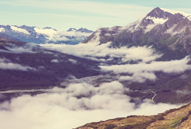 Picturesque Mountains of Alaska in summer. Snow covered massifs, glaciers and rocky peaks.