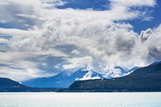 Picturesque Mountains of Alaska in summer. Snow covered massifs, glaciers and rocky peaks.