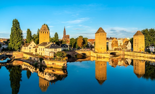 Picturesque panoramic view of strasbourg overlooking ponts couverts with four towers in the historic