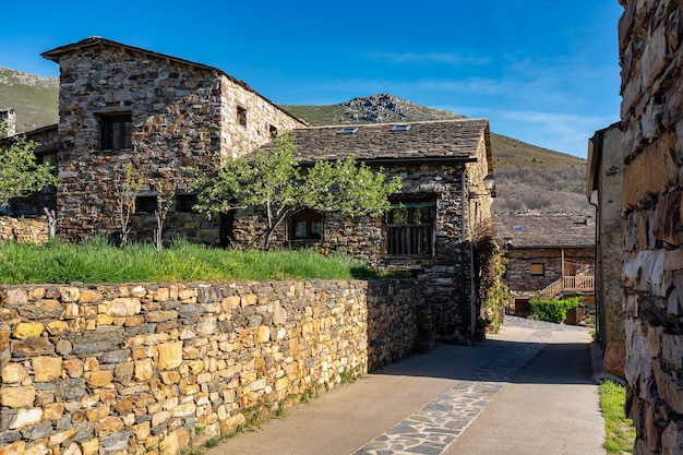 Picturesque streets with stone houses next to the mountains in Guadalajara Valverde