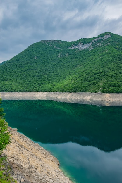 The picturesque turquoise lake is among the high mountains