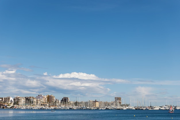 Picturesque view of the city and yachts on the sea