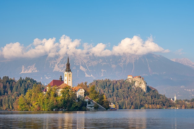 Picturesque view of the island on Lake Bled with Pilgrimage Church of the Assumption of Maria with reflection. Slovenia, Europe.