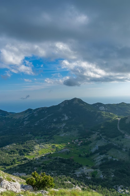 The picturesque village is located among the mountains in the rays of sunset