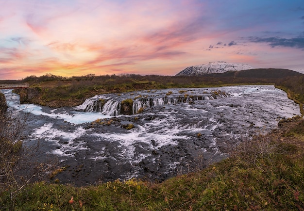 Picturesque waterfall Bruarfoss autumn view Season changing in southern Highlands of Iceland