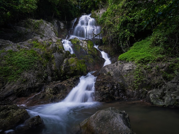 Picturesque waterfall cascade on granite rocks in dense tropical forest Namuang 2 Samui Thailand