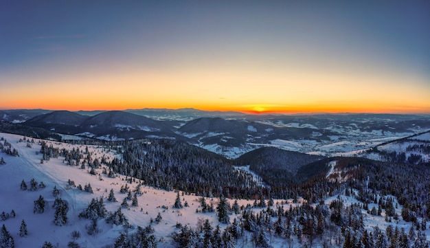 Picturesque winter panorama of mountain hills