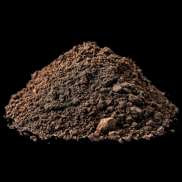 Photo a piece of brown dirt is shown in a black background