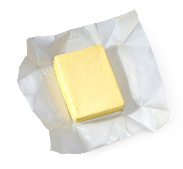 Piece of butter isolated on white background, top view, with clipping path