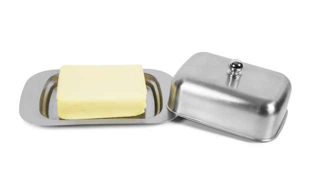 Piece of butter in metal box on white background