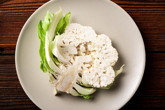 A piece of cauliflower closeup on a plate Vegetarian concept healthy eating