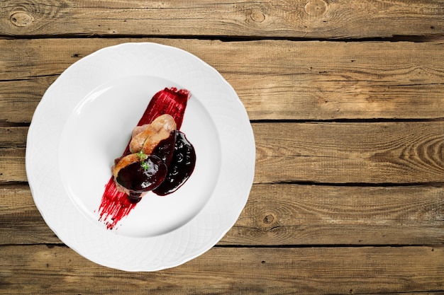 Piece of chocolate cake on white plate